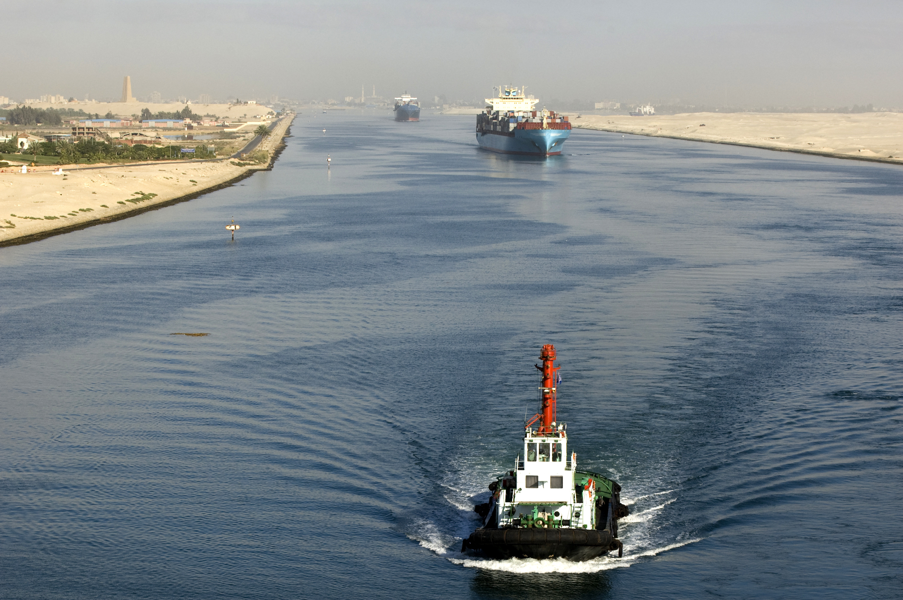 Pilot boat and freighter on the Suez canal